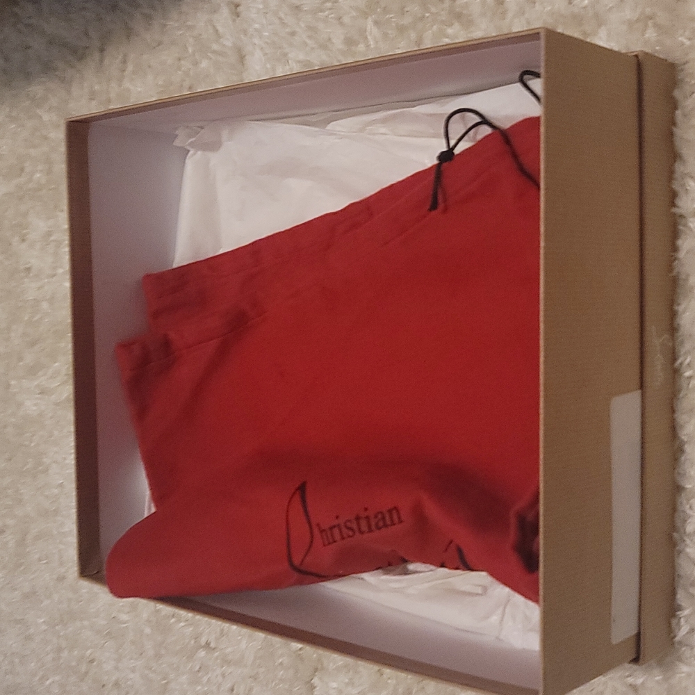 Christian louboutin shoe box and 1 set of dust bags.